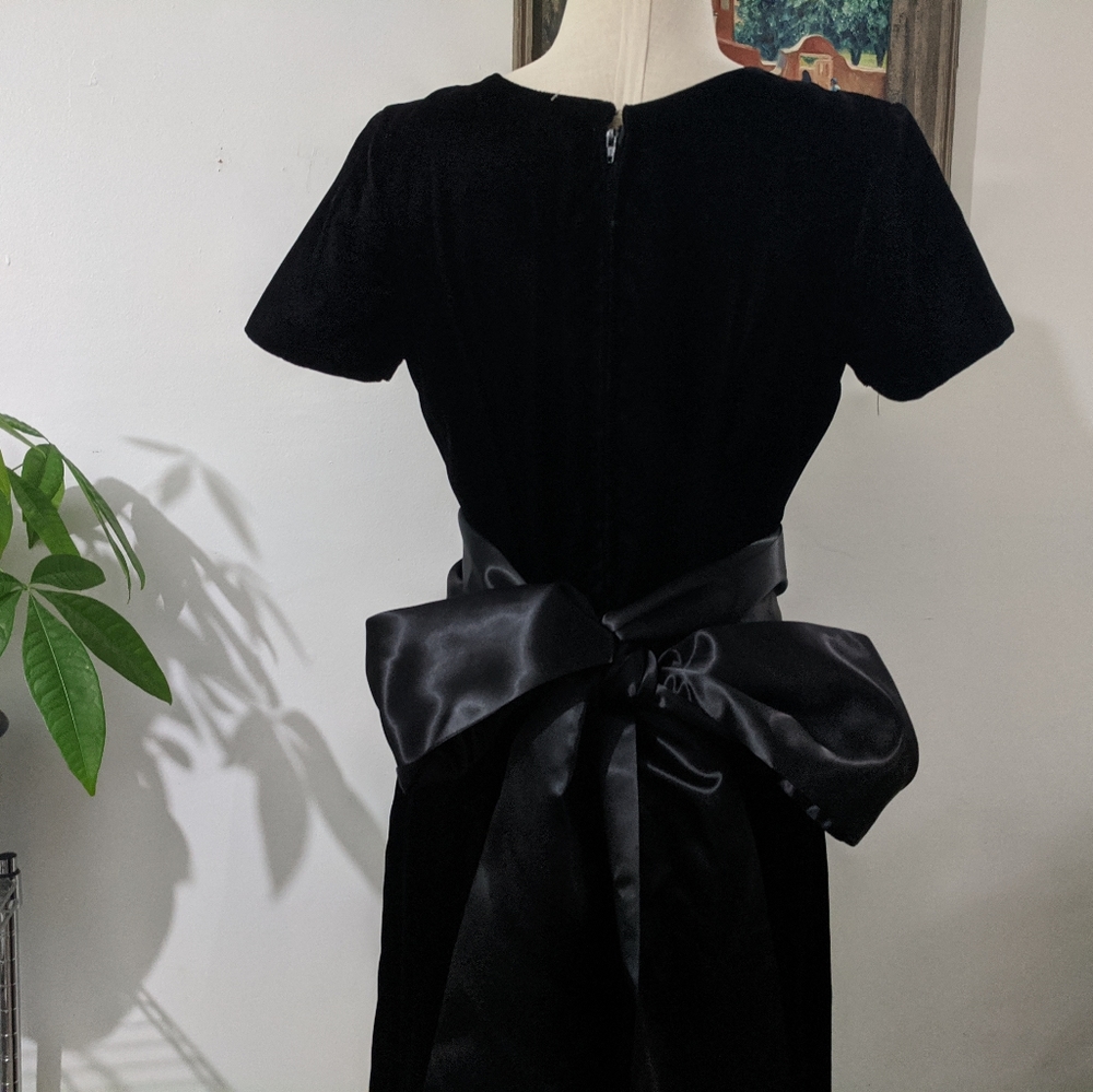 Velvet floor length gown featuring large back bow